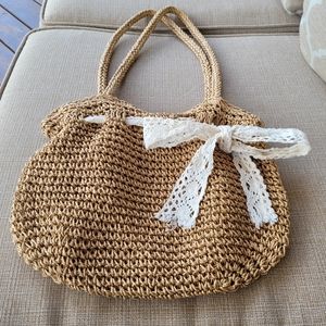 Straw / Wicker shoulder bag with lace bow detail